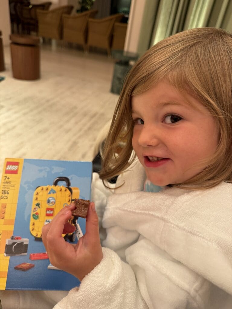 My daughter with the Lego toy the hotel staff surprised her with