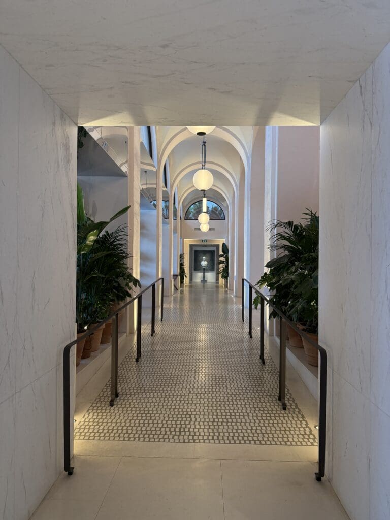 Arched hallway leading to the spa at the Lake Como EDITION